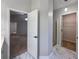 Bathroom showcasing modern design with doorways to closet, shower, and other bedroom areas at 2004 Westover Nw Ln, Kennesaw, GA 30152