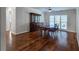 Bright dining room with hardwood floors, a ceiling fan, and a large window with natural light at 2004 Westover Nw Ln, Kennesaw, GA 30152