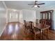 Open dining area featuring hardwood floors and a classic china cabinet for elegant storage at 2004 Westover Nw Ln, Kennesaw, GA 30152