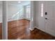 Welcoming entryway with hardwood floors, featuring elegant columns and natural light at 2004 Westover Nw Ln, Kennesaw, GA 30152