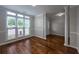 Bright entryway featuring hardwood floors, elegant columns, trim, and a large window at 2004 Westover Nw Ln, Kennesaw, GA 30152