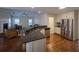 Open concept kitchen with granite countertops, stainless steel appliances, hardwood floors overlooking living room at 2004 Westover Nw Ln, Kennesaw, GA 30152