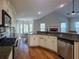 Bright kitchen with stainless steel appliances, granite countertops, hardwood floors and open floorplan at 2004 Westover Nw Ln, Kennesaw, GA 30152