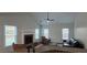 Bright living room featuring a fireplace, vaulted ceilings, hardwood floors, and lots of natural light at 2004 Westover Nw Ln, Kennesaw, GA 30152