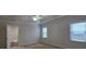 Comfortable bedroom featuring a ceiling fan, natural light, and neutral decor at 2004 Westover Nw Ln, Kennesaw, GA 30152