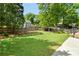 Large, well-maintained backyard with lush green grass and a wooden fence at 2849 Livsey Woods Dr, Tucker, GA 30084
