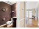 Stylish half bathroom featuring a dark vanity, and elegant fixtures at 2849 Livsey Woods Dr, Tucker, GA 30084