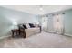 A well-lit bedroom with a daybed and large windows dressed with white curtains at 2849 Livsey Woods Dr, Tucker, GA 30084