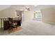 A bonus room with a large desk, carpet, and an attic window seat at 2849 Livsey Woods Dr, Tucker, GA 30084