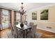 Elegant dining room featuring neutral colors, hardwood floors, and a large window at 2849 Livsey Woods Dr, Tucker, GA 30084