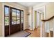 Welcoming foyer with hardwood floors, traditional wainscoting, and a view of the front door at 2849 Livsey Woods Dr, Tucker, GA 30084