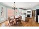 Charming breakfast nook featuring bright windows and a modern kitchen in the background at 2849 Livsey Woods Dr, Tucker, GA 30084
