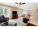 Comfortable living room featuring natural light, hardwood floors, and ceiling fan at 2849 Livsey Woods Dr, Tucker, GA 30084