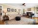 Comfortable living room featuring natural light, fireplace and built-in shelving at 2849 Livsey Woods Dr, Tucker, GA 30084