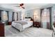 Comfortable main bedroom with plenty of natural light and neutral carpeting at 2849 Livsey Woods Dr, Tucker, GA 30084