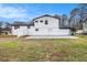A view of the fenced backyard and a brick and white exterior on this home at 3862 Northstrand Dr, Decatur, GA 30035