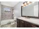 Updated bathroom featuring a tub-shower, modern vanity, and stylish tile flooring at 3862 Northstrand Dr, Decatur, GA 30035