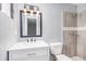 Updated bathroom featuring a walk-in shower and modern vanity at 3862 Northstrand Dr, Decatur, GA 30035