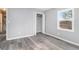 This bedroom has gray walls, wood-look flooring and a closet at 3862 Northstrand Dr, Decatur, GA 30035