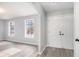 Welcoming entryway featuring double doors and gray wood-look flooring at 3862 Northstrand Dr, Decatur, GA 30035