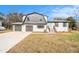 Charming two-story home featuring a brick facade, two-car garage, and a welcoming blue front door at 3862 Northstrand Dr, Decatur, GA 30035