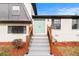 Close-up of the entryway, featuring a light blue double door with black hardware and a newly constructed staircase at 3862 Northstrand Dr, Decatur, GA 30035