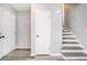 Neutral hallway featuring a staircase and access to other rooms at 3862 Northstrand Dr, Decatur, GA 30035