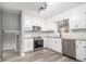 This kitchen has white cabinets, stainless appliances and granite counters at 3862 Northstrand Dr, Decatur, GA 30035