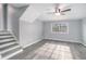 This living room has gray walls, wood-look flooring, stairs and a window at 3862 Northstrand Dr, Decatur, GA 30035