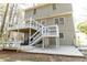 View of the home's tiered back decks, patios, and backyard at 1468 Cheyenne Ct, Stone Mountain, GA 30087