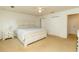Bright bedroom with white walls and carpet featuring a white bed set and ceiling fan at 1468 Cheyenne Ct, Stone Mountain, GA 30087