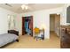 Bedroom featuring a ceiling fan, closet, window, desk and carpet at 1468 Cheyenne Ct, Stone Mountain, GA 30087