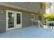 Exterior view of house deck with stairway and door to yard and beautiful surrounding trees at 1468 Cheyenne Ct, Stone Mountain, GA 30087