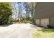 Long driveway leading to a two-car garage, providing extra parking space and potential for outdoor activities at 1468 Cheyenne Ct, Stone Mountain, GA 30087