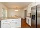 Bright kitchen with granite counters, white cabinetry and breakfast area at 1468 Cheyenne Ct, Stone Mountain, GA 30087