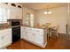 Kitchen with sleek appliances, granite countertops, and a view into the breakfast nook at 1468 Cheyenne Ct, Stone Mountain, GA 30087