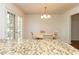 Bright and airy kitchen features granite counters and access to the backyard at 1468 Cheyenne Ct, Stone Mountain, GA 30087