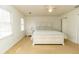 Serene main bedroom with a calming color scheme, plush carpet, and a large bed with bedside tables at 1468 Cheyenne Ct, Stone Mountain, GA 30087