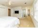 Spacious main bedroom featuring white walls, carpet, a ceiling fan, and a Primary bath at 1468 Cheyenne Ct, Stone Mountain, GA 30087