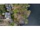 Aerial view of the property showing the house, yard, and lake at 1510 Wood Thrush Way, Marietta, GA 30062