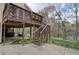Back deck with stairs down to the patio and backyard with lake view at 1510 Wood Thrush Way, Marietta, GA 30062