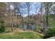 Large backyard with lush lawn and a view of the lake at 1510 Wood Thrush Way, Marietta, GA 30062
