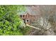 Traditional brick front exterior featuring manicured landscaping and mature trees at 1510 Wood Thrush Way, Marietta, GA 30062
