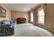 Bright living room with carpeted floors, large windows, neutral paint, and classic furnishings, inviting relaxation and comfort at 1510 Wood Thrush Way, Marietta, GA 30062