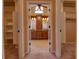 En Suite bathroom featuring double vanity with dark wood cabinets and matching framed mirrors and walk in closets at 1510 Wood Thrush Way, Marietta, GA 30062