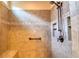 Tiled shower with shower head, seating, grab bar, and built in toiletry cubbies at 1510 Wood Thrush Way, Marietta, GA 30062
