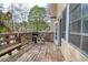 Wooden deck with a grill, bench, and view of the neighborhood at 1510 Wood Thrush Way, Marietta, GA 30062