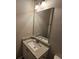 Bathroom features a granite countertop vanity, modern lighting, and a large mirror at 3763 Waldrop Hills Dr, Decatur, GA 30034