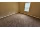 Bright bedroom with soft carpeting and a window, creating a cozy and inviting atmosphere at 3763 Waldrop Hills Dr, Decatur, GA 30034