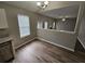 Bright dining area featuring wood floors, modern lighting, and a view into the living space at 3763 Waldrop Hills Dr, Decatur, GA 30034